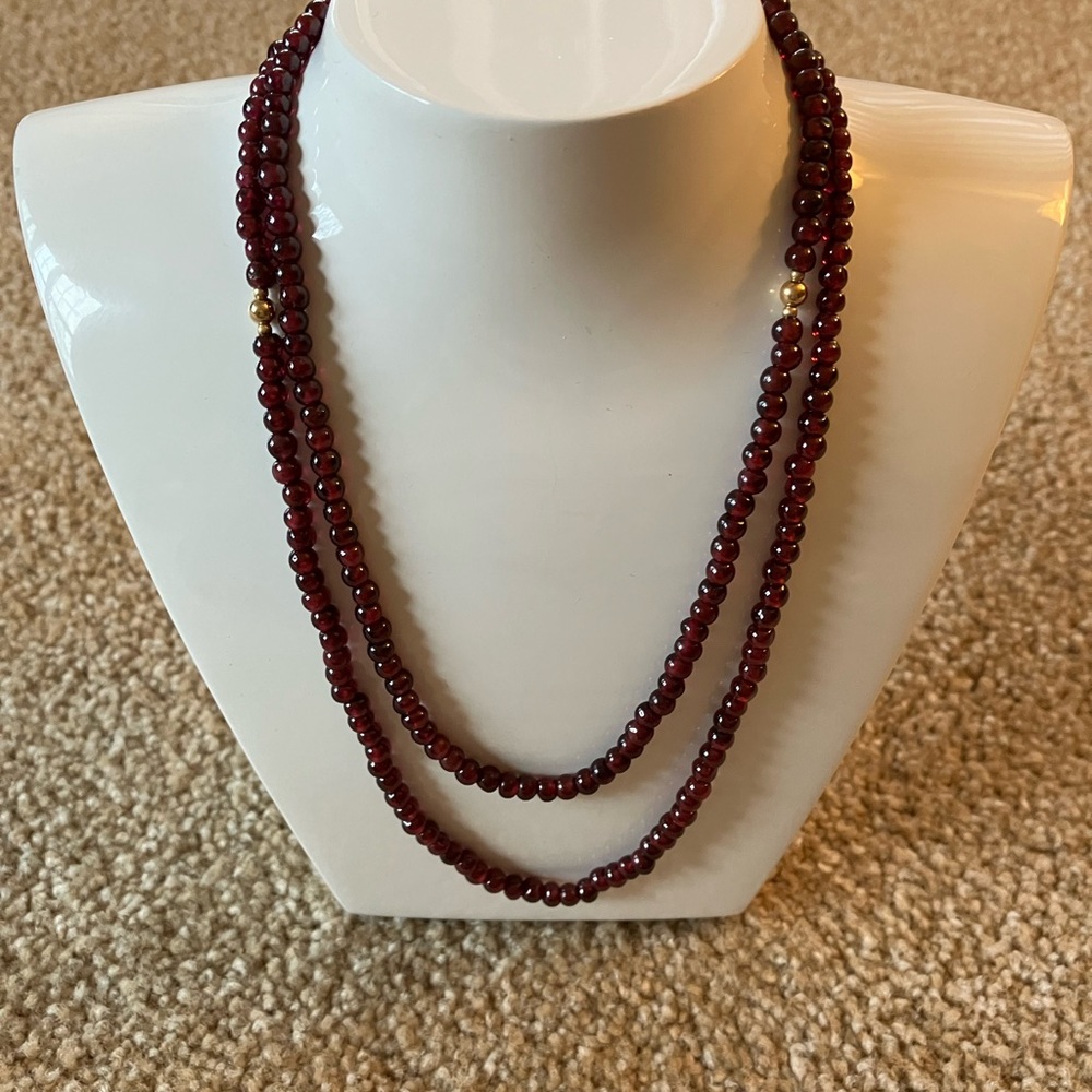 Women’s garnet necklace and earrings